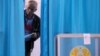 Kazakhstan - A man hols his ballot during presidential election in the village of Tuzdybastau outside Almaty, Kazakhstan, June 9, 2019. REUTERS/Pavel Mikheyev