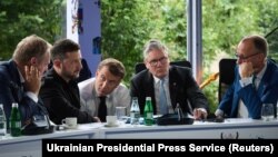 From left: Polish Prime Minister Donald Tusk, Ukrainian President Volodymyr Zelenskyy, French President Emmanuel Macron, UK Prime Minister Keir Starmer, and German Chancellor Friedrich Merz speak with US President Donald Trump by phone from Tirana on May 16.