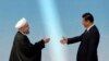 China -- Iranian President Hassan Rohani (L) is greeted by his Chinese counterpart Xi Jinping before the opening ceremony of the fourth Conference on Interaction and Confidence Building Measures in Asia summit in Shanghai, May 21, 2014