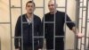 Журналіст Олексій Назімов (п) і депутат міськради Алушти Павло Степанченко (л)