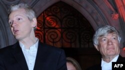U.K. -- Wikileaks founder Julian Assange (L) with his lawyer Geoffrey Robertson, as he addresses the media outside the High Court in central London, 16Dec2010