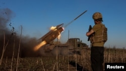 Ukrainian service members of the 25th Sicheslav Airborne Brigade fire a BM-21 Grad multiple rocket launch system towards Russian troops near the frontline town of Pokrovsk, amid Russia's attack on Ukraine, in Donetsk region, Ukraine April 19, 2025.