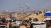 Displaced Palestinians flee southward in the central Gaza Strip after Israeli forces ordered residents of Gaza City to evacuate