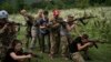 Ukraine Nationalist Youth Camp-In this July 29, 2018 photo, young participants of the "Temper of will" summer camp, organized by the nationalist Svoboda party, practice tactical formations with AK-47 assault riffles in a village near Ternopil, Ukraine. (A